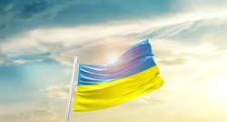 Ukraine national flag waving in beautiful clouds.