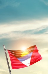 Antigua and Barbuda national flag waving in beautiful clouds.