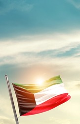 Kuwait national flag waving in beautiful clouds.