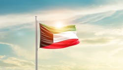 Kuwait national flag waving in beautiful sky.