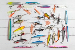 Colorful Fishing Lures on wood desk different fishing baits