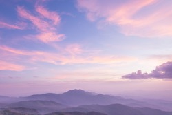 Purple sky, misty mountains and clouds