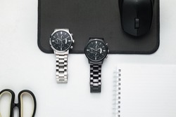 Luxury blacks and silver watch on white Table. Business man accessories