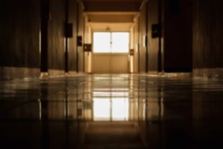Blur pathway in dormitory or condominium and reflection with the soft light. Blur long dark hallway