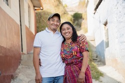 Happy Hispanic couple in the village - Guatemalan couple with typical Mayan costume