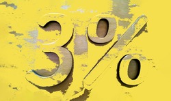 Percentage sign on wood wall with peeled illuminating yellow paint. Three 3 percent. Sale background. Mortgage loan. Typescript. Discounts concept. Interest rate. Wooden material. Ecology. Modern art.