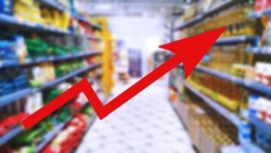 Red growing up arrow on Abstract blur image of supermarket background. Bar charts and graphs. Rising food prices. Inflation concept. Retail industry. Finance and Economy. Stock Market. Shop.