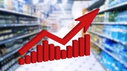 Red growing up large arrow on abstract blur image of supermarket background. Bar charts and graphs. Rising food prices. Inflation concept. Retail industry. Finance and Economy. Stock Market. Store.