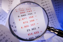 Magnifier focused red numbers on a billing