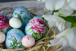 Decorating Easter eggs with decoupage technique. Eggs in a basket