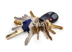 Building manager key set or onsite caretaker. Multiple keys on key chain. Keys for: elevator, fire panel, service room, residential and commercial doors, pad lock, garage gate fob. Isolated on white.