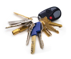 Key set of caretaker or building manager. Multiple keys on key chain. Keys for: elevator, fire panel, service room, residential and commercial doors, pad lock, garage gate fob. Isolated on white