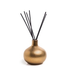 Isolated incense holder with incense sticks. Shiny gold or yellow colored incense vase or incense burner with white background. Used during meditation, religious practice or freshen up the scents.