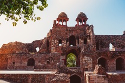 The main building of a famous monument in Delhi, constructed in 16th century AD on a beautiful sunny summer morning.Ruins of a historical Old Fort of North India known as Purana Qila or Quila.