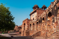 Arches made with red sandstone at a popular travel destination in Delhi, India. Amphitheatre at a castle in an old fort also known as Purana Qila or Quila.