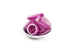 a small dish of Slices of a red cooking onions cut into rings isolated on white