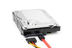 A internal computer SATA hard disk drive with power and data cables ready to attach isolated on white