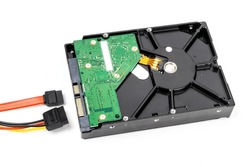 A SATA desktop computer hard disk drive with power and data cables not attached isolated on white