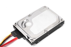 Top side of case view of a SATA computer hard disk drive with power and data cables attached isolated on white