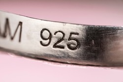 Real silver stamp, 925 number mark on a real silver ring, indicating the purity of the precious metal in the jewellery. Detail macro shot