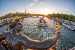 Alexandre III bridge in Paris against Eiffel Tower with boat on Seine, France