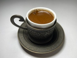 A cup of foamy Turkish coffee