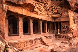 badami cave no one chalukya dynasty ancient stone art from flat angle image is taken at badami karnataka india. it is unesco heritage site and place of amazing chalukya dynasty sotne art.
