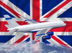 Great Britain flag with white airplane and clouds. The concept of tourist international passenger transportation.