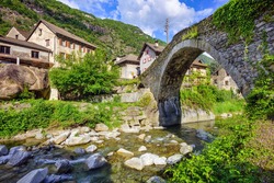 Historical stone bridge in Giornico village is one of the most famous roman  landmarks in Ticino canton, Switzerland