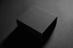 Empty black box on black background 