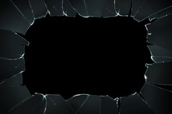 Broken glass with space for text on black background