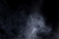 blurry smoke floating on a black background