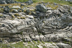 Characteristic appearance of a metamorphic rock derived from the exaggerated deformation of sandstone