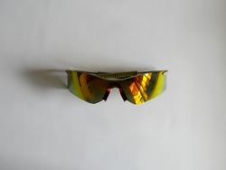 Modern stylish black sports bike sunglasses with rainbow lenses isolated on white background. Bicycle glasses