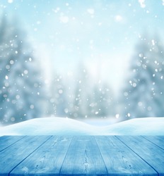 Merry Christmas and happy New Year greeting background with table .Winter landscape with snow 