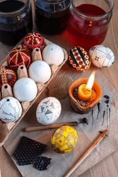 traditional creation of Ukrainian Easter eggs with wax, dyes, and a pen