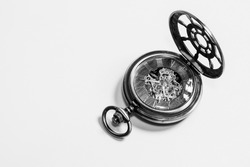 Black and white photo of an antique pocket watch.