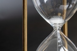 Hourglass with little time left.