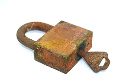 Padlock and key isolated on white background.rust.Corrosive Rust on old iron.Use as illustration for presentation.Rust of metals.                     