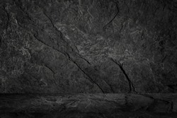 Empty dark grunge old plank table top, isolated on dark stone background, used to display a product montage. and leave some space to change your background.                            