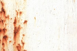 Corroded metal background. Rusted white painted metal wall. Rusty metal background with streaks of rust. Rust stains. The metal surface rusted spots. Rystycorrosion.                    