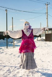 A effigy stuffed woman in winter. A female scarecrow is also pagan.