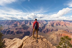 Travel in Grand Canyon, man Hiker with backpack enjoying view, USA