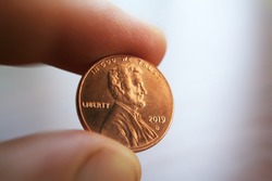 2019 Penny In Fingers Close Up High Quality 