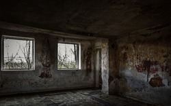 Room with windows in an abandoned building