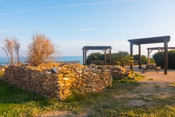 Picnic area near the sea in the Serra d'Irta Natural Park, Alcossebre, Spain. Wooden structure. Beautiful spot to relax and have a snack.