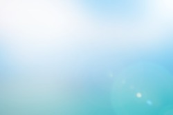 abstract blurred blue sky pastel tone background with sunny flare light