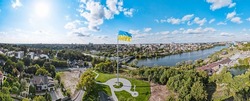 Ukraine flag on background of panoramic provincial country town Vinnytsia beautiful city with river