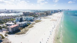 Island Clearwater Beach FL. Ocean or shore Gulf of Mexico. Spring break or Summer vacations in Florida. Hotels, restaurants and Resorts. Tropical Nature. Aerial view.