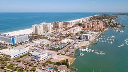 Island Clearwater Beach FL. Ocean or Gulf of Mexico shore. Spring break or Summer vacations in Florida. Hotels, restaurants and Resorts. Tropical Nature. Aerial view of city. United States of America.